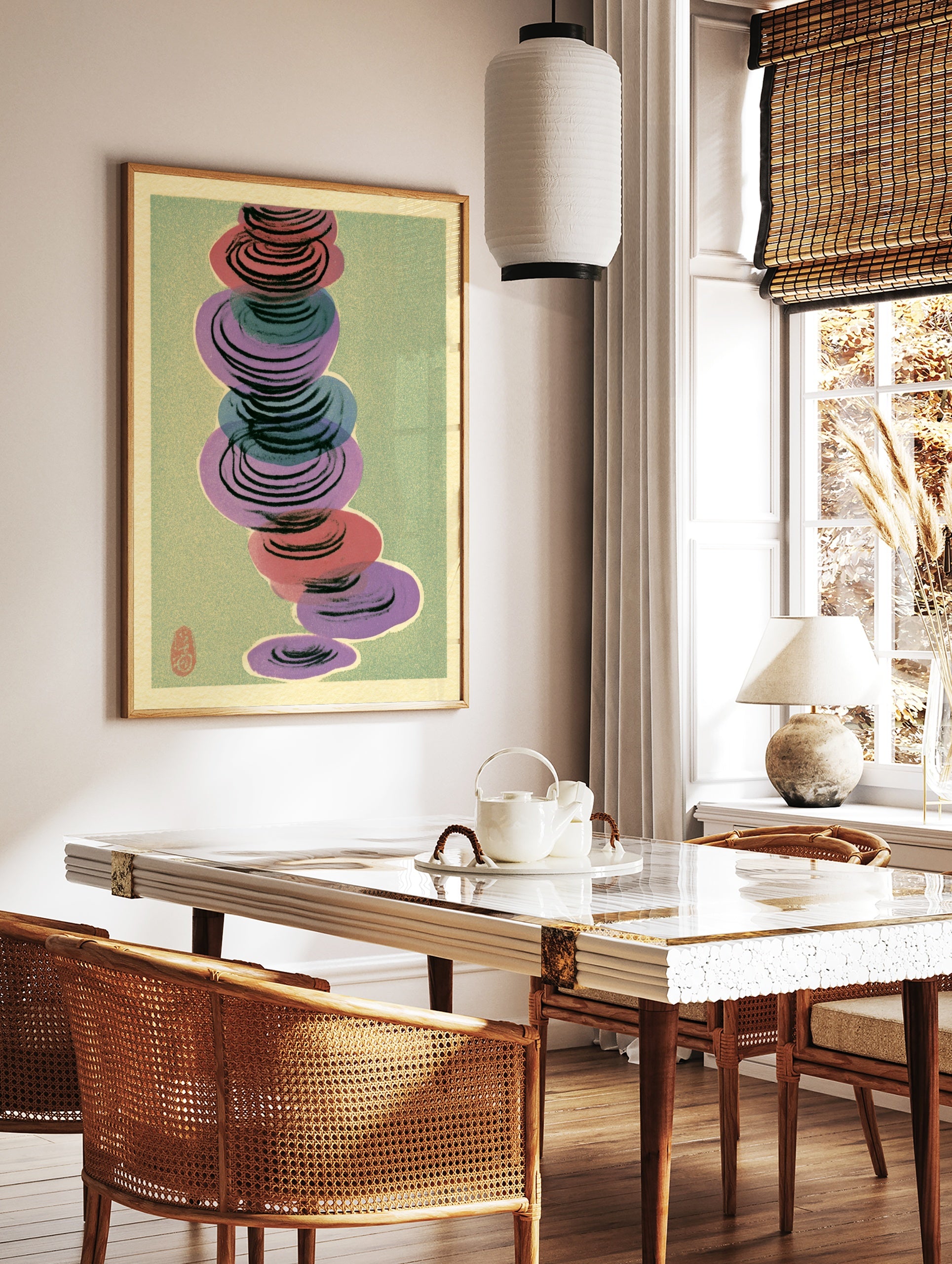 Abstract wall art with stacked red, purple, and blue circular shapes on a muted green background, in a styled room mockup