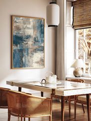 Abstract wall art print with blue, beige, and grey textured brushstrokes and layered, expressive, in a styled room mockup