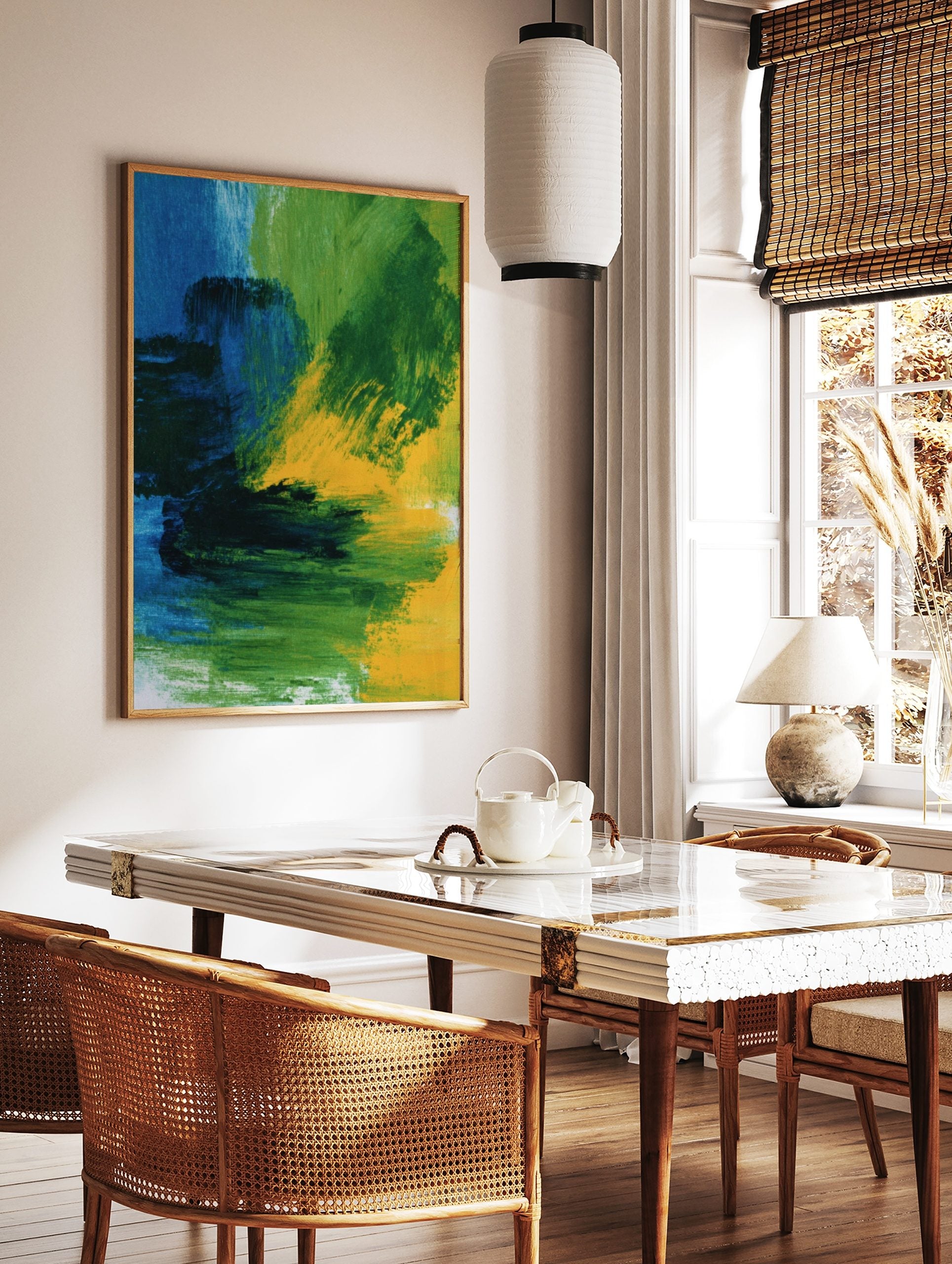 Abstract wall art print with bold blue, green, and yellow painterly brushstrokes and dynamic, in a styled room mockup