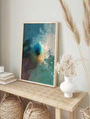 Textured abstract art print with deep blue, teal, white, and ochre colours, featuring a, in an alternate framed mockup