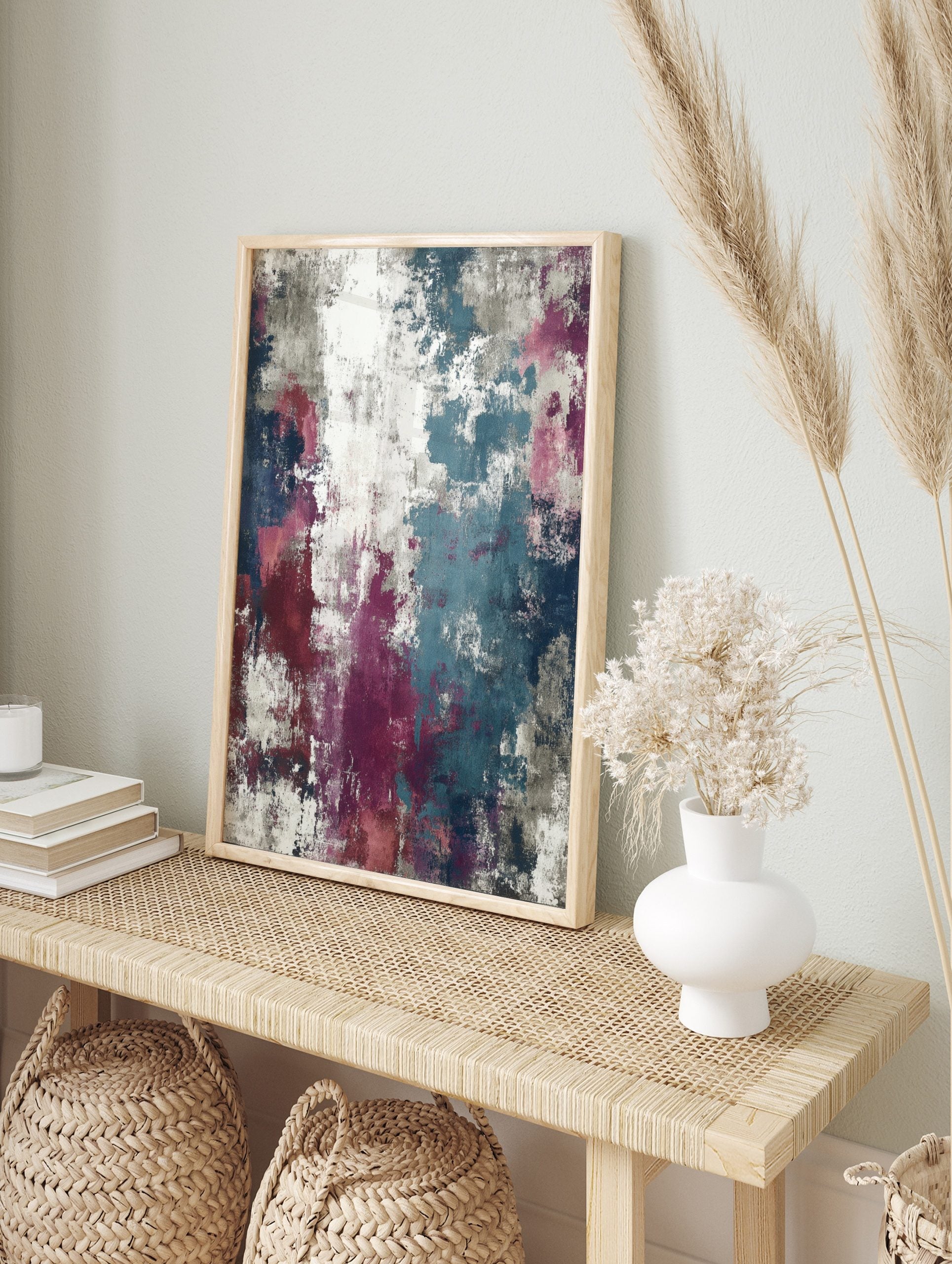Abstract wall art print with distressed textures in teal, magenta, navy, grey, and white, in an alternate framed mockup