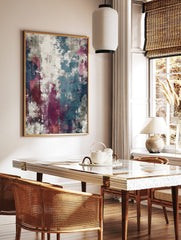 Abstract wall art print with distressed textures in teal, magenta, navy, grey, and white, in a styled room mockup