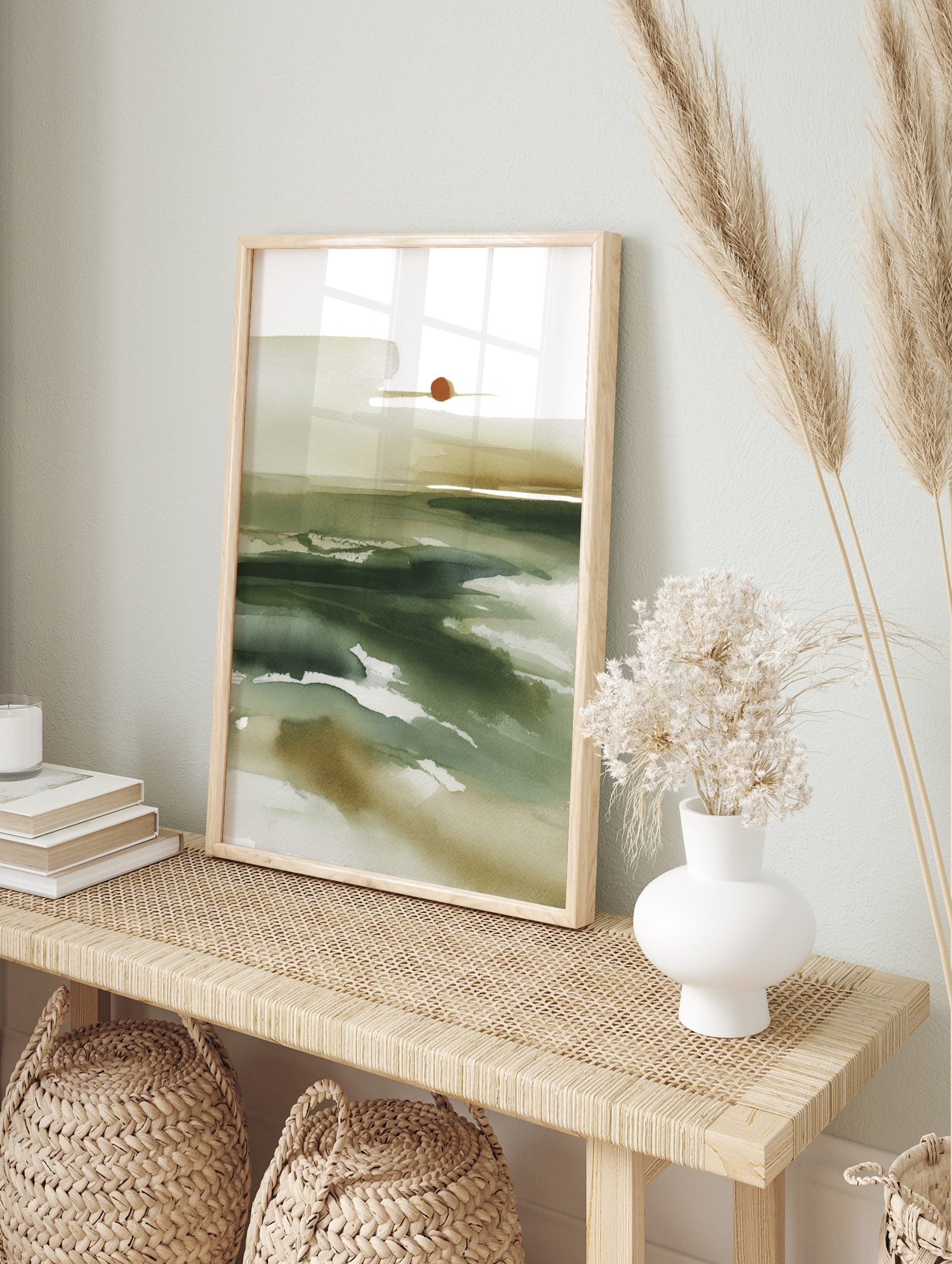 Abstract watercolour landscape wall art with deep green and beige washes, and a reddish-brown, in an alternate framed mockup