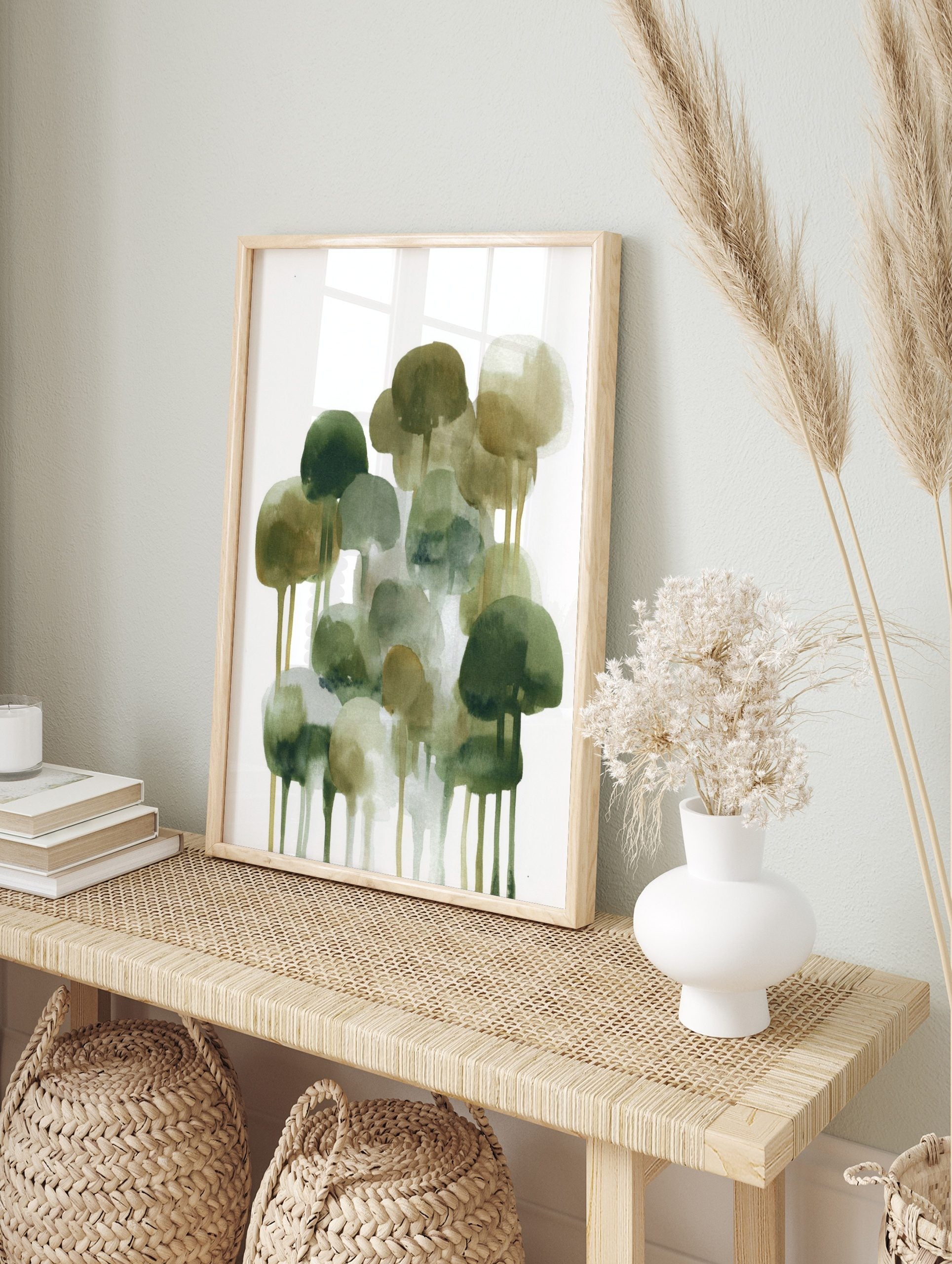Abstract watercolour art print with green, olive, and brown tree-like shapes and drips on a, in an alternate framed mockup