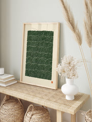 Abstract green wave pattern print with repeating lines on a cream background, in an alternate framed mockup