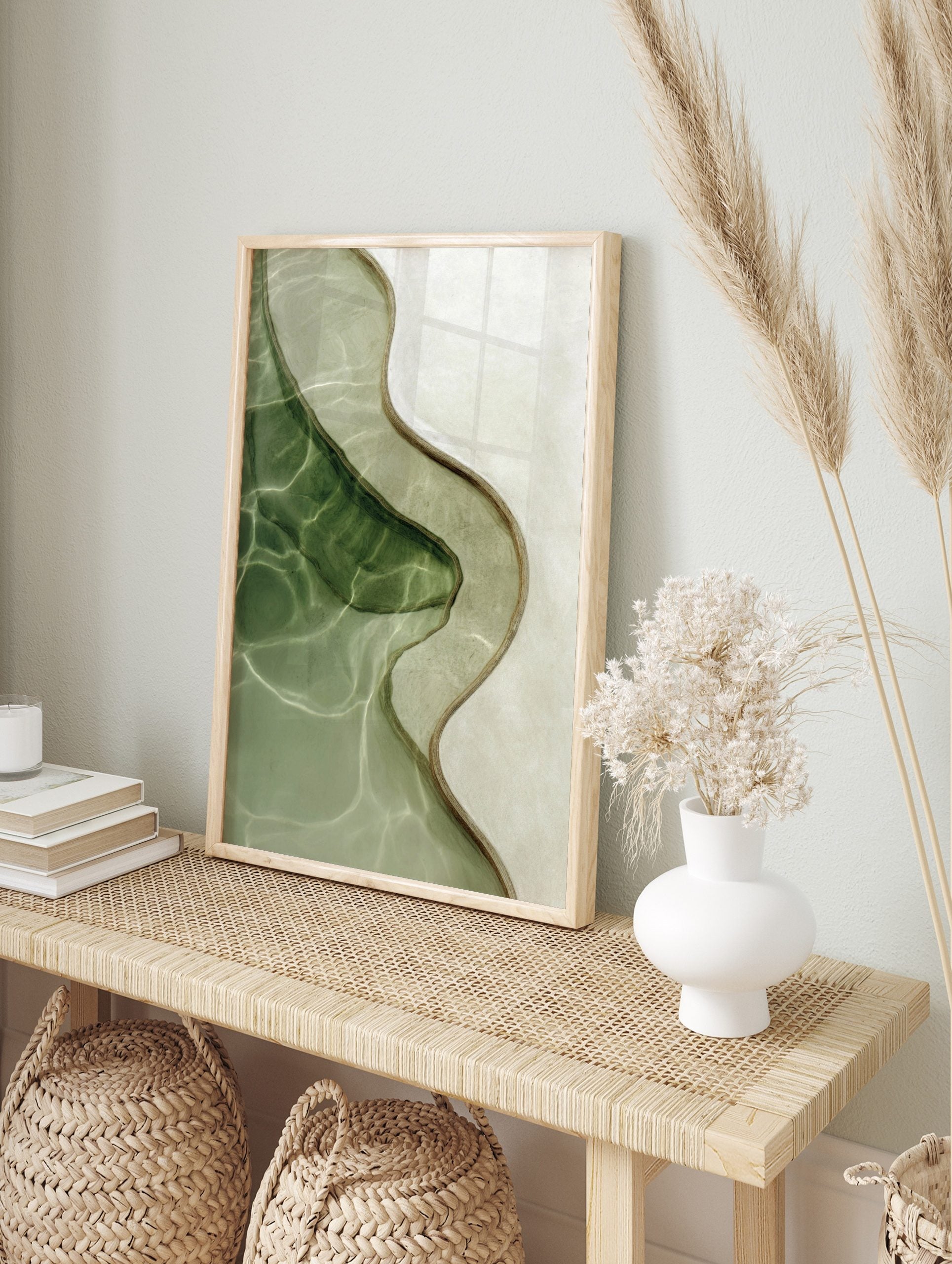 Overhead view of abstract wavy organic lines in green and beige water with light reflections, in an alternate framed mockup