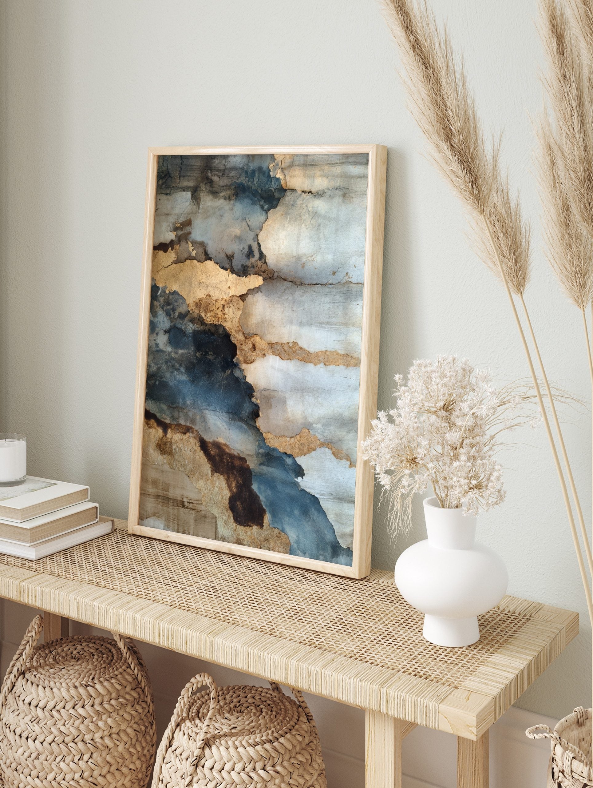 Abstract weathered wall art with layers of blue, grey, and textured gold, depicting peeling, in an alternate framed mockup