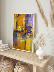 Abstract painting with textured yellow and purple brushstrokes creating a modern, distressed, in an alternate framed mockup