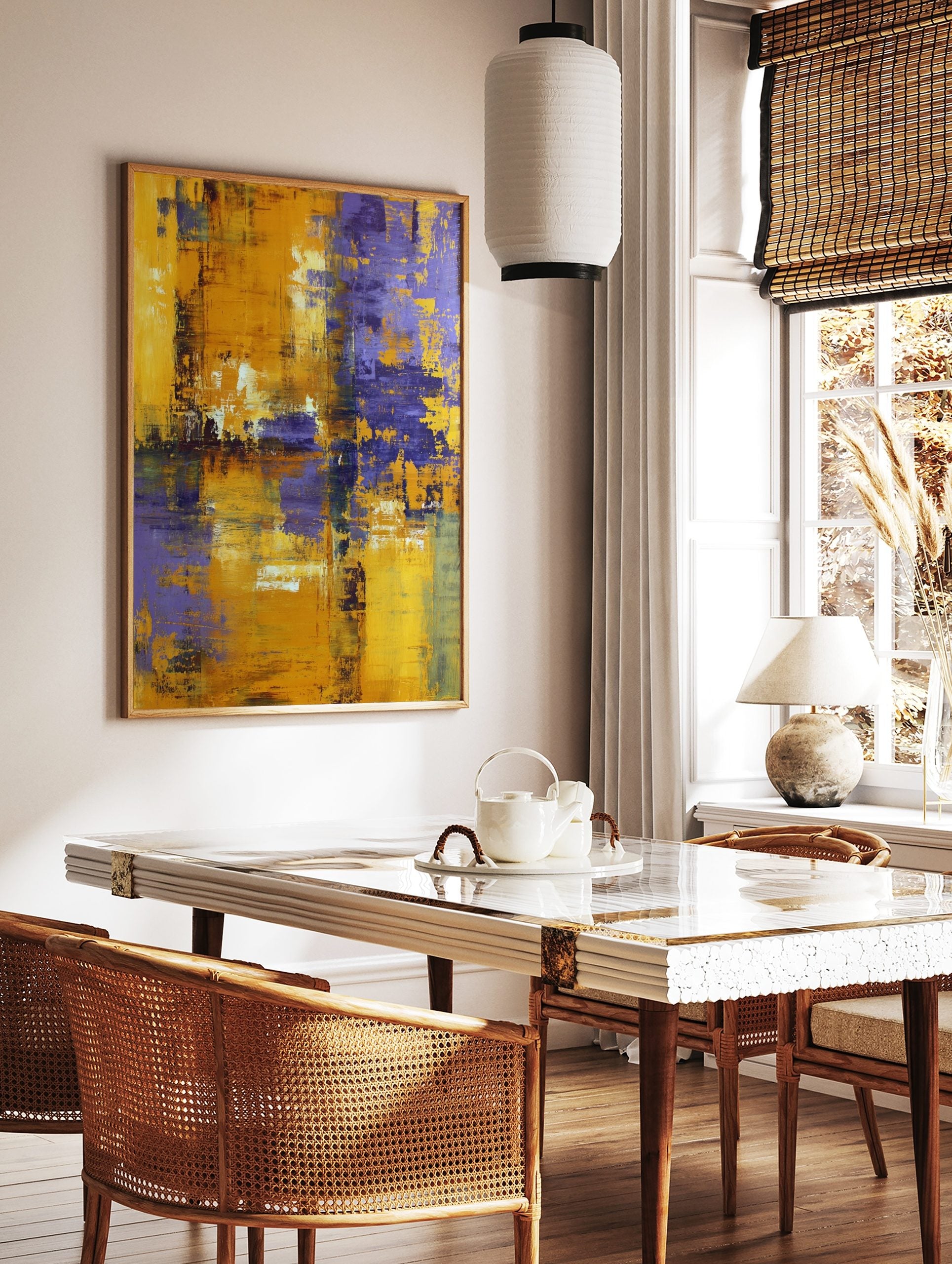 Abstract painting with textured yellow and purple brushstrokes creating a modern, distressed art, in a styled room mockup