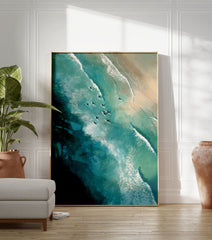Aerial view poster of surfers on white surfboards in clear blue-green ocean water with waves near a sandy beach, painted style. - Image 3