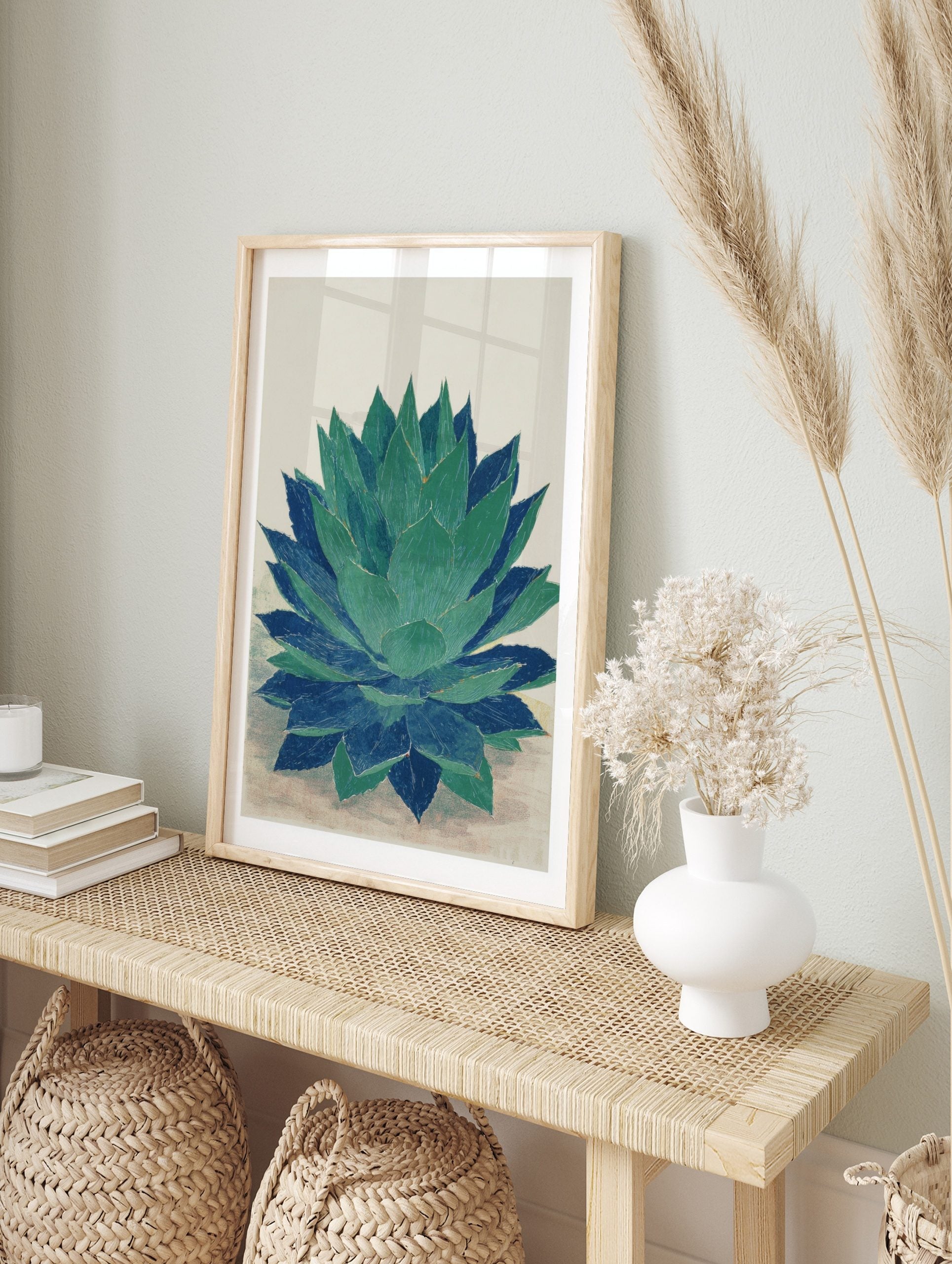 Agave plant botanical wall art print in green and blue with textured illustration style, in an alternate framed mockup