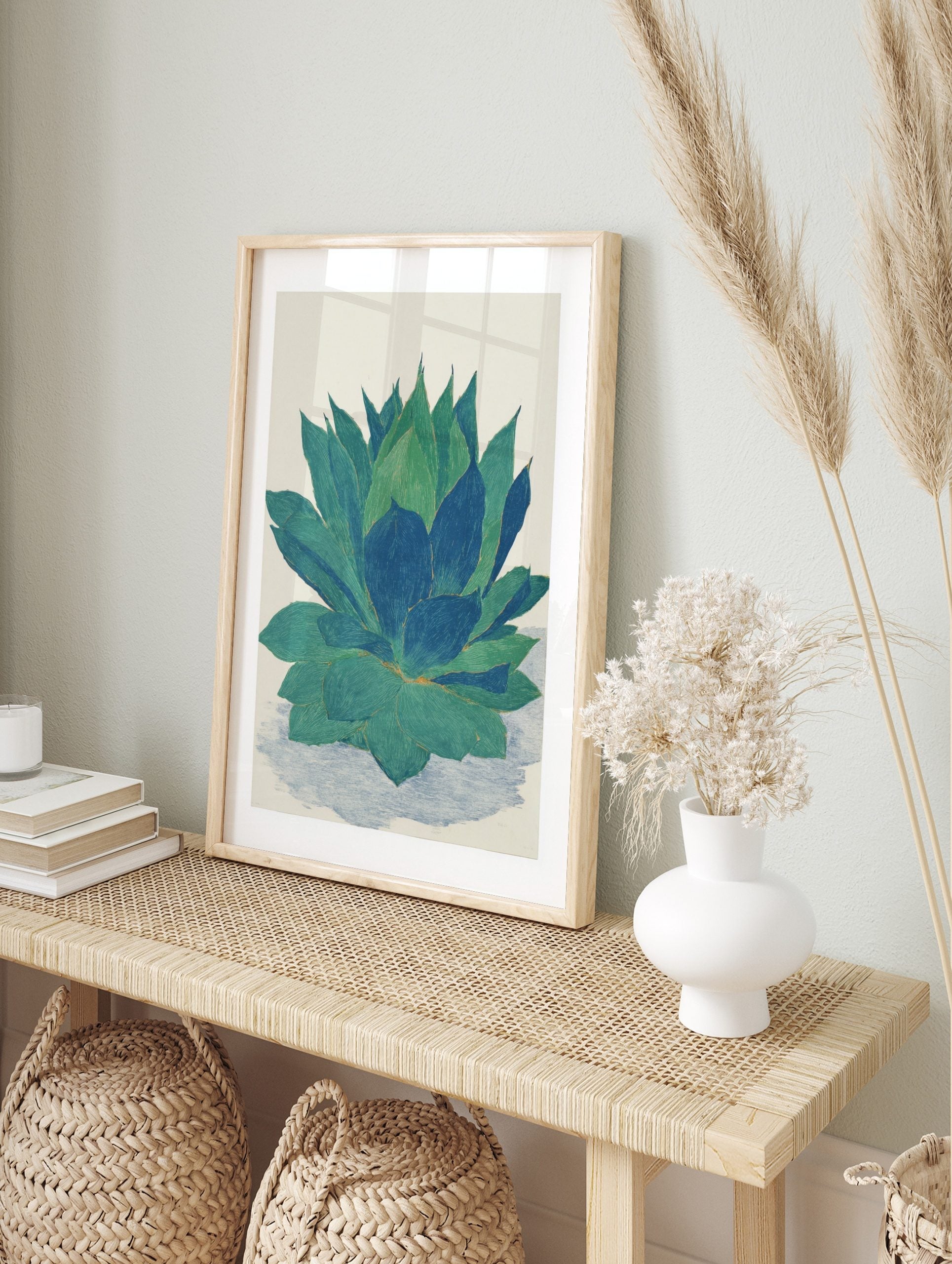 Botanical illustration print of an agave plant with large green and blue succulent leaves on, in an alternate framed mockup