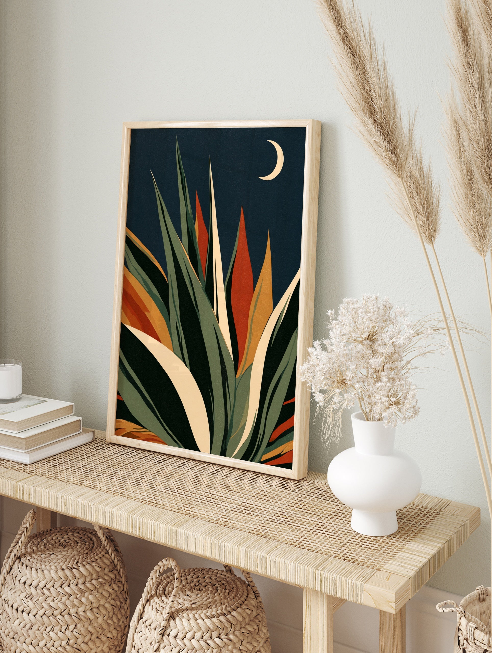 Stylised agave succulent plant illustration with green and orange leaves against a navy, in an alternate framed mockup