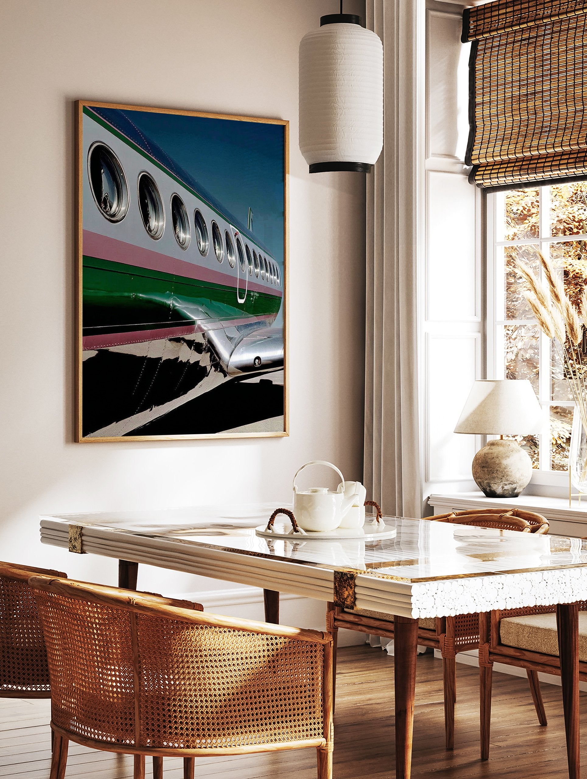 Close-up of an airplane's silver and green fuselage with windows, a modern aviation photography wall art print. - Image 2