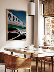 Close-up of an airplane's silver and green fuselage with windows, a modern aviation photography wall art print. - Image 2