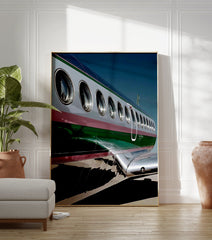 Close-up of an airplane's silver and green fuselage with windows, a modern aviation photography wall art print. - Image 3