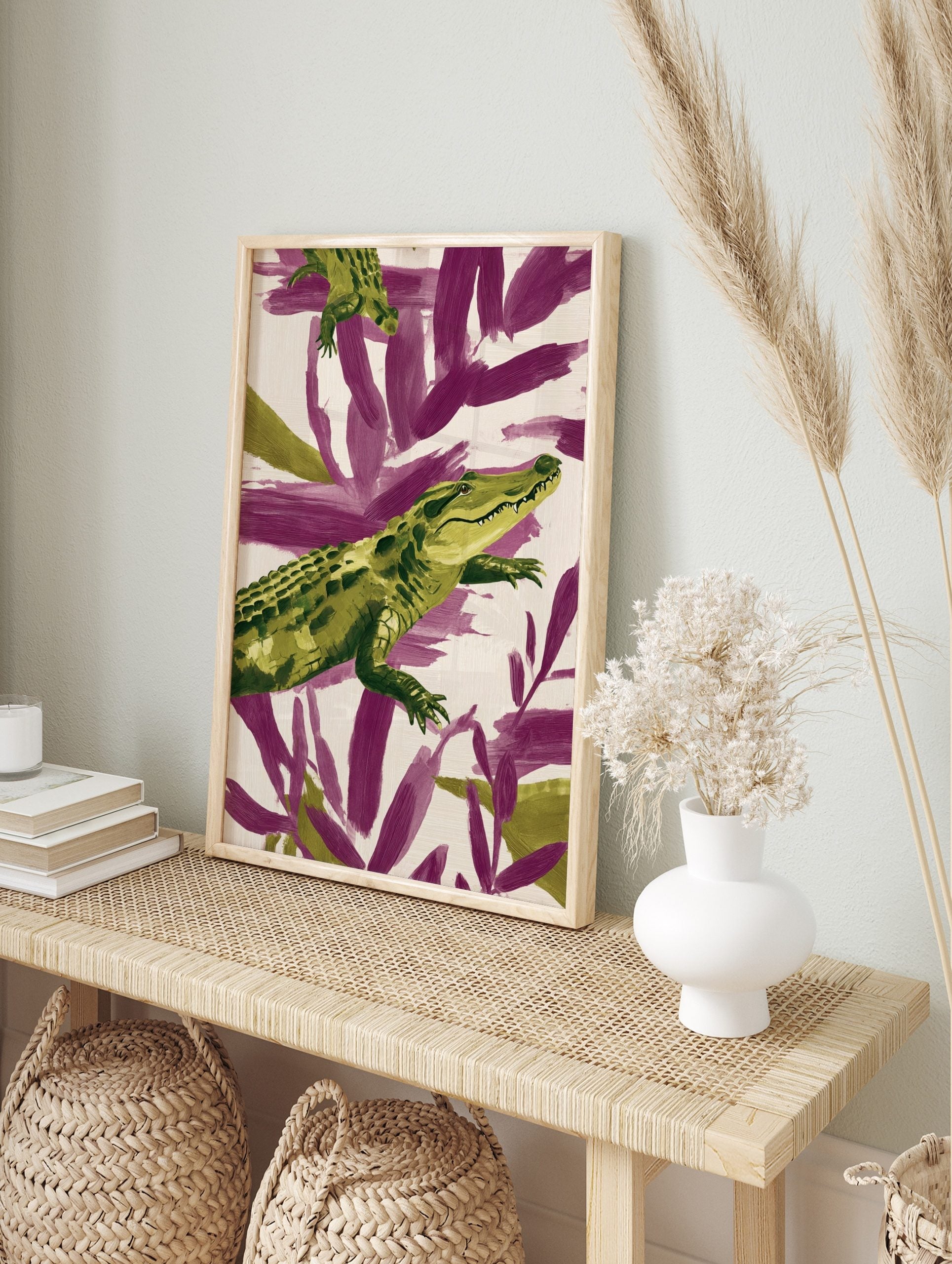 Green alligator illustration against purple and cream abstract brushstrokes, in an alternate framed mockup