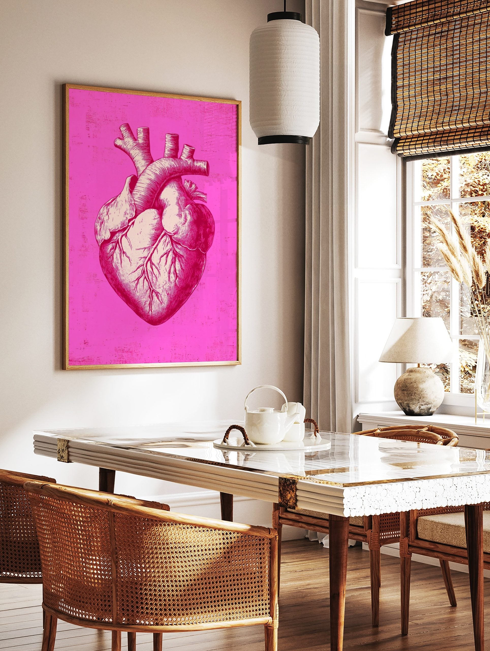 Detailed anatomical heart illustration print in bright pink and off-white with distressed background, in a styled room mockup