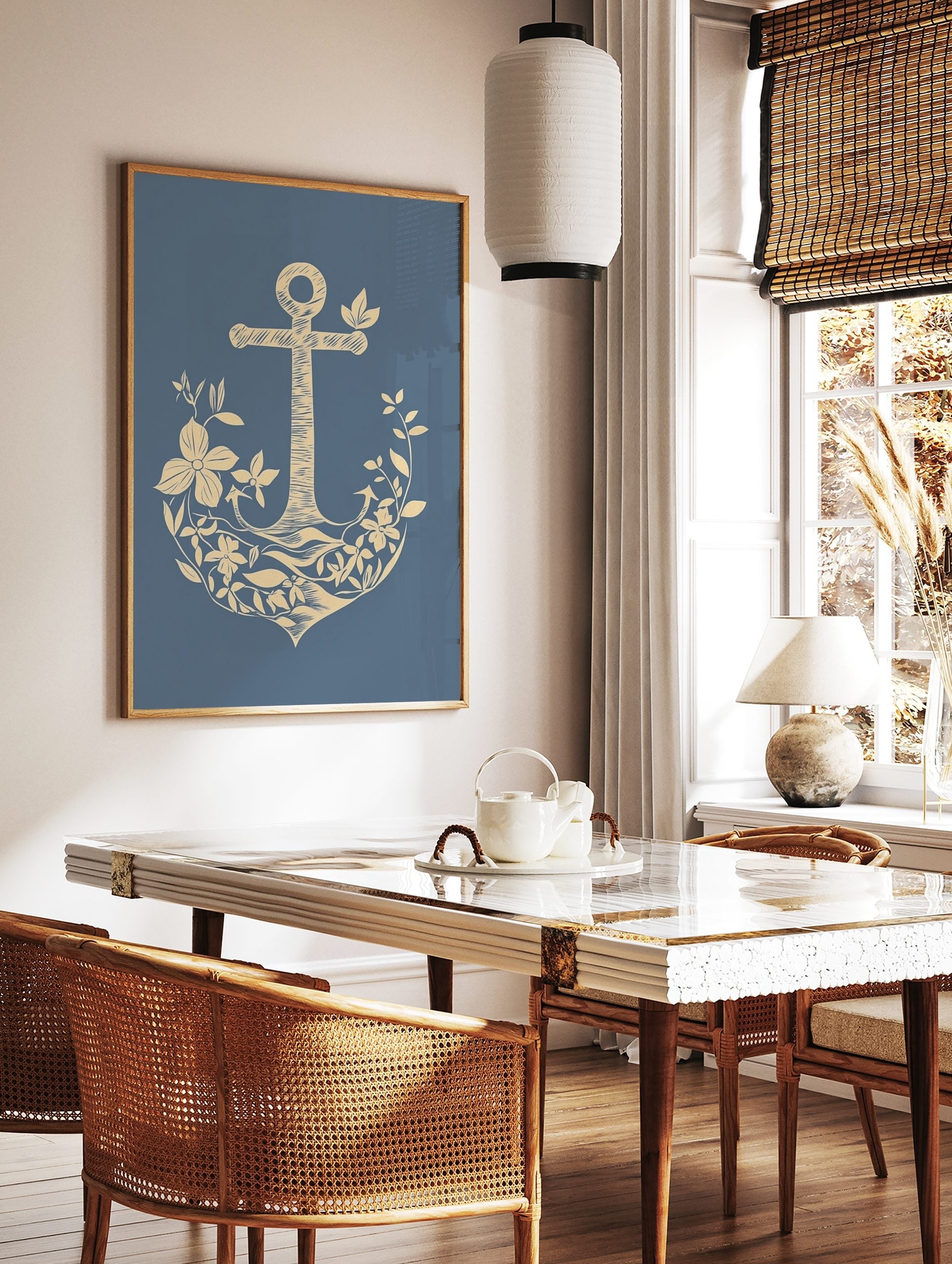Illustrative beige anchor adorned with botanical flowers and leaves on a blue background, in a styled room mockup