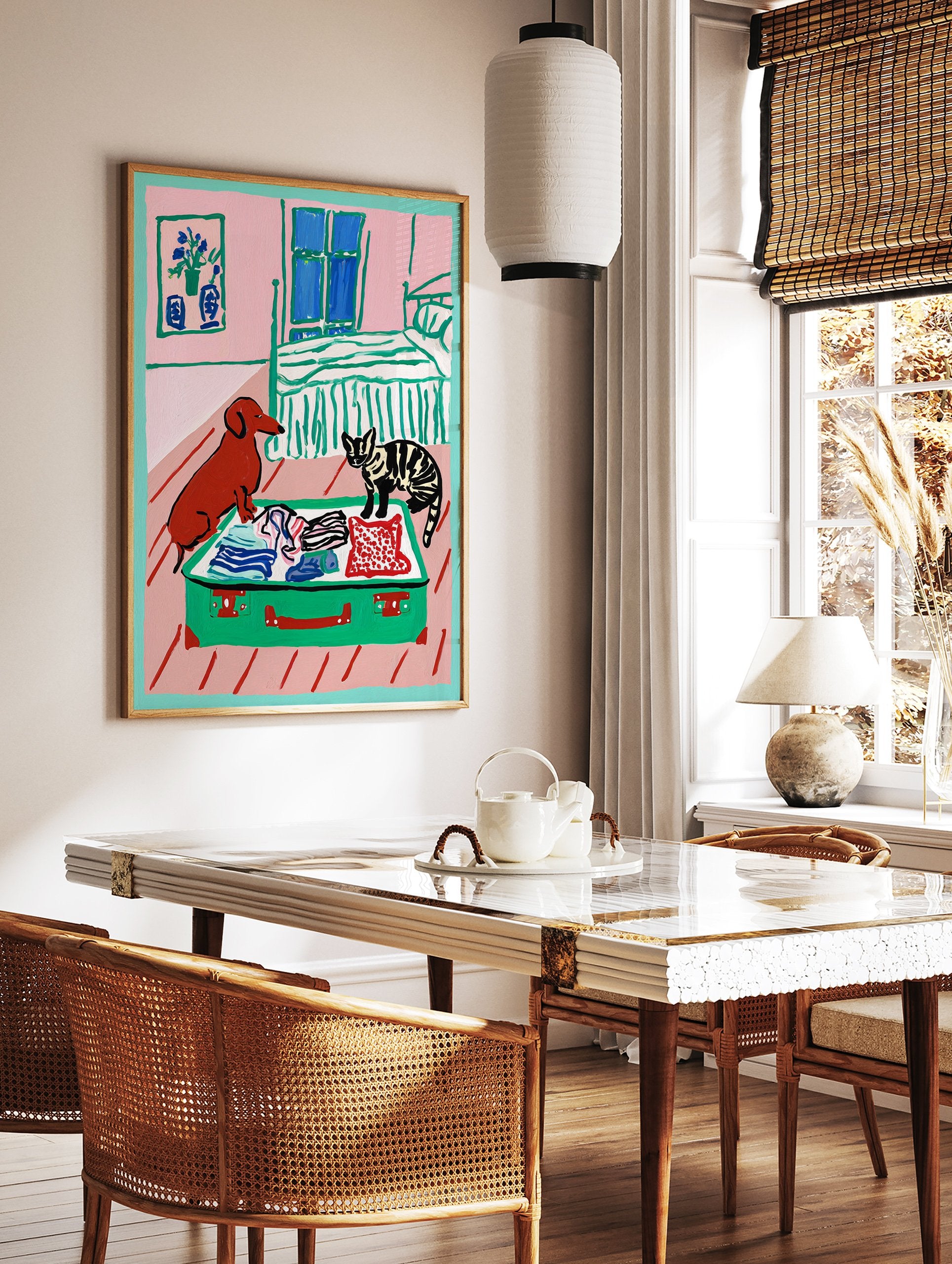 Painting of a brown dog and striped cat looking into an open green suitcase with clothes in a pink bedroom. - Image 2