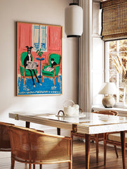Illustrative animal wall art featuring a black and white dog and cat reading newspapers in green chairs against a pink wall. - Image 2