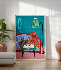 Illustrative animal wall art featuring a brown dog and a spotted cat reading a book on a blue striped couch with a green lamp. - Image 3