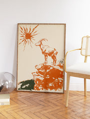 Orange illustrative print of a mountain goat on a rocky cliff under a stylized sun. Vintage animal wall art. - Image 2