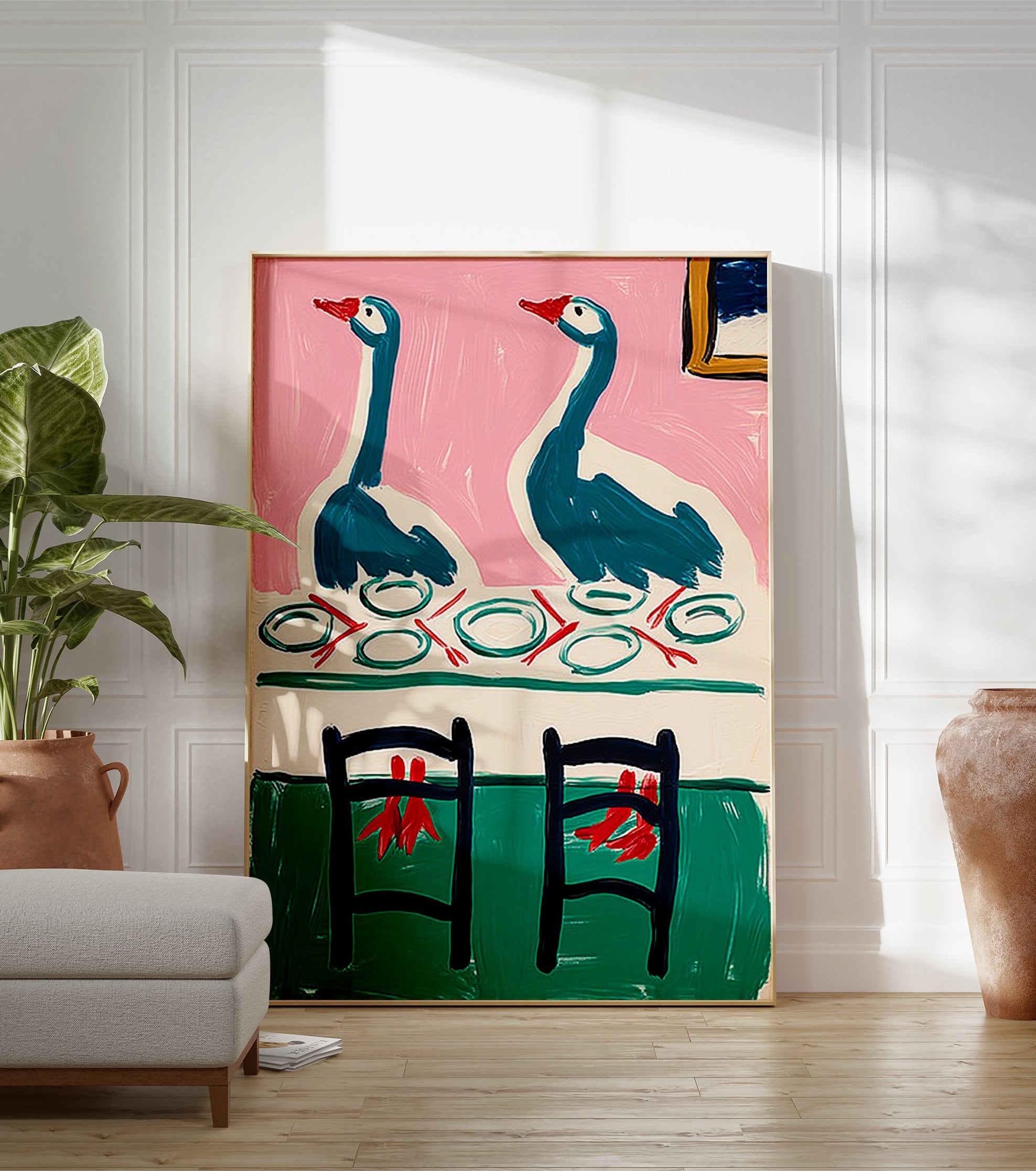 Painting of two teal geese with red beaks at a dinner table with plates, against a pink wall and green floor. Whimsical goose art. - Image 3