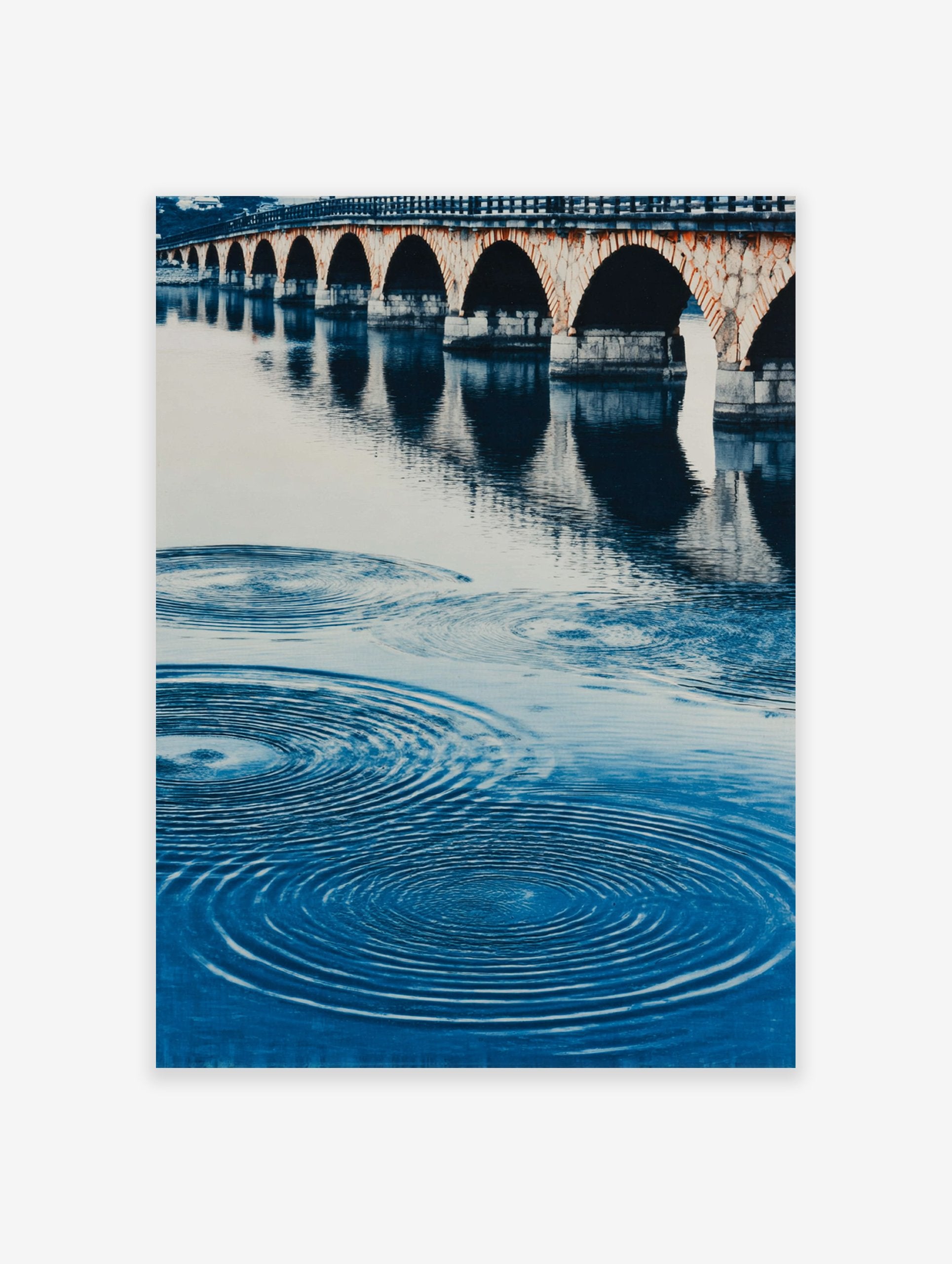 A blue water arch bridge poster featuring a stone bridge with multiple arches reflected in rippling water.
