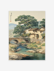 Traditional Asian landscape wall art depicting a Chinese village with a stone bridge over a river, large trees, and mountains.