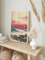 Traditional Asian Landscape Wall Art featuring a village with dark roofs by misty waters, mountains, and a red sunset with a white sun. - Image 3
