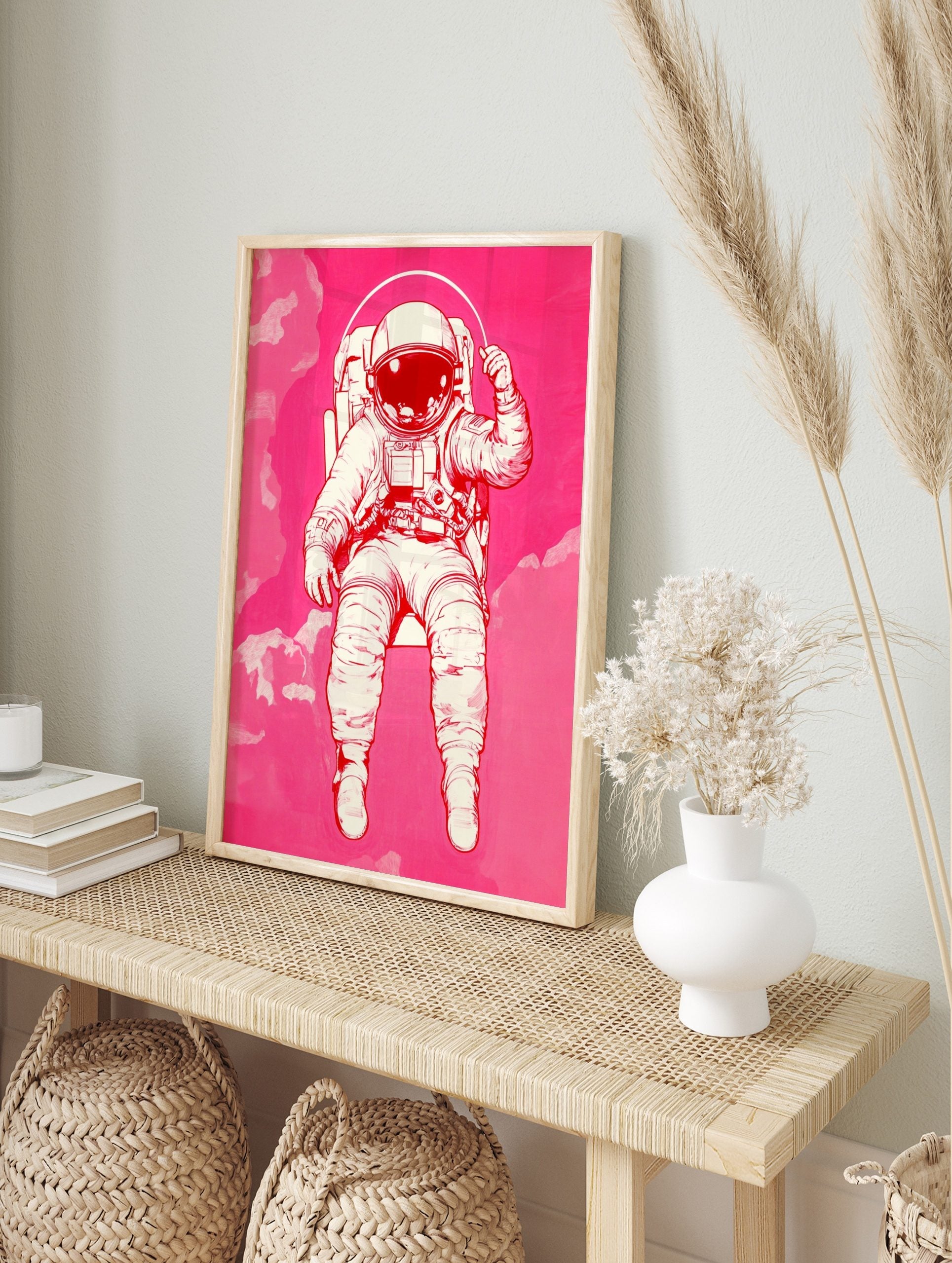 Illustrative astronaut in an off-white spacesuit with a reflective visor, floating against a, in an alternate framed mockup