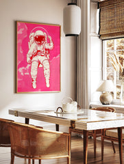 Illustrative astronaut in an off-white spacesuit with a reflective visor, floating against a hot, in a styled room mockup