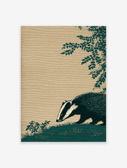 Illustrative dark teal badger with white stripes sniffing grass, textured beige background, and green leaves