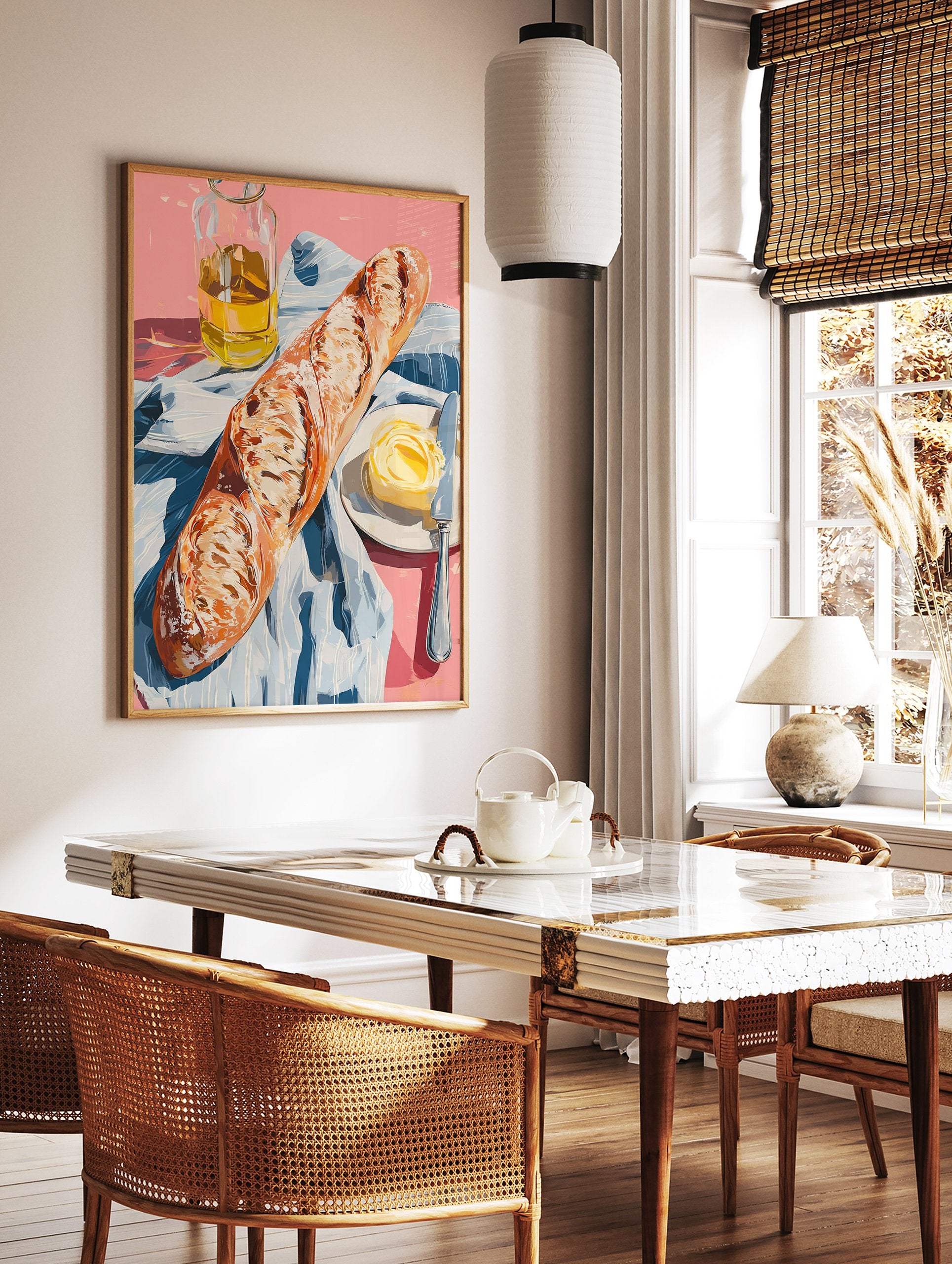 A poster depicting a still life of a baguette, a pat of butter with a knife on a plate, and a bottle of olive oil on a pink surface with a blue and white striped cloth. - Image 2