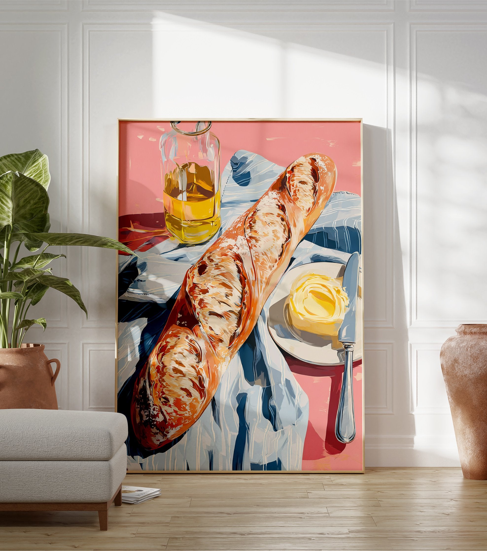 A poster depicting a still life of a baguette, a pat of butter with a knife on a plate, and a bottle of olive oil on a pink surface with a blue and white striped cloth. - Image 3