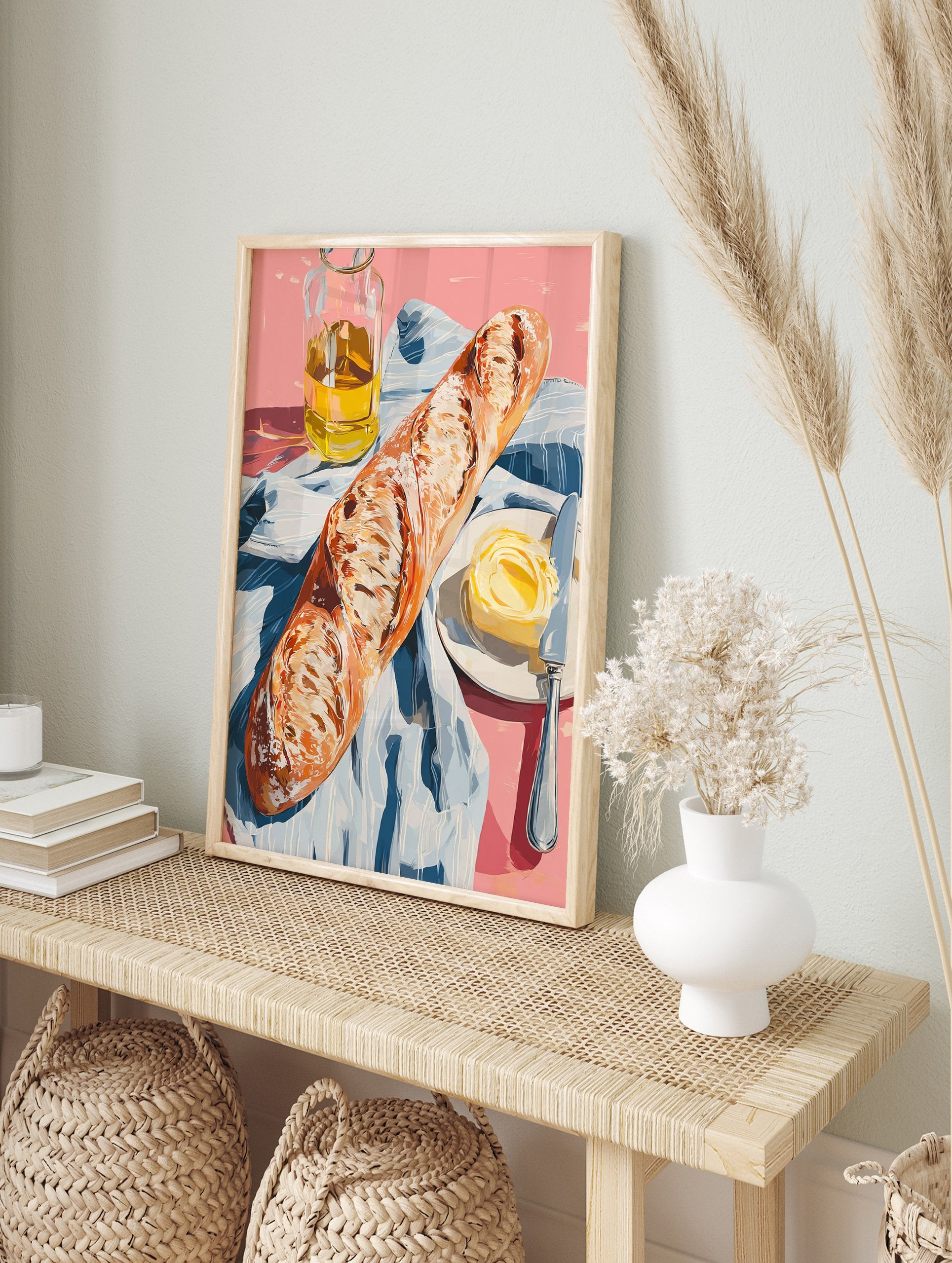 A poster depicting a still life of a baguette, a pat of butter with a knife on a plate, and a bottle of olive oil on a pink surface with a blue and white striped cloth. - Image 4