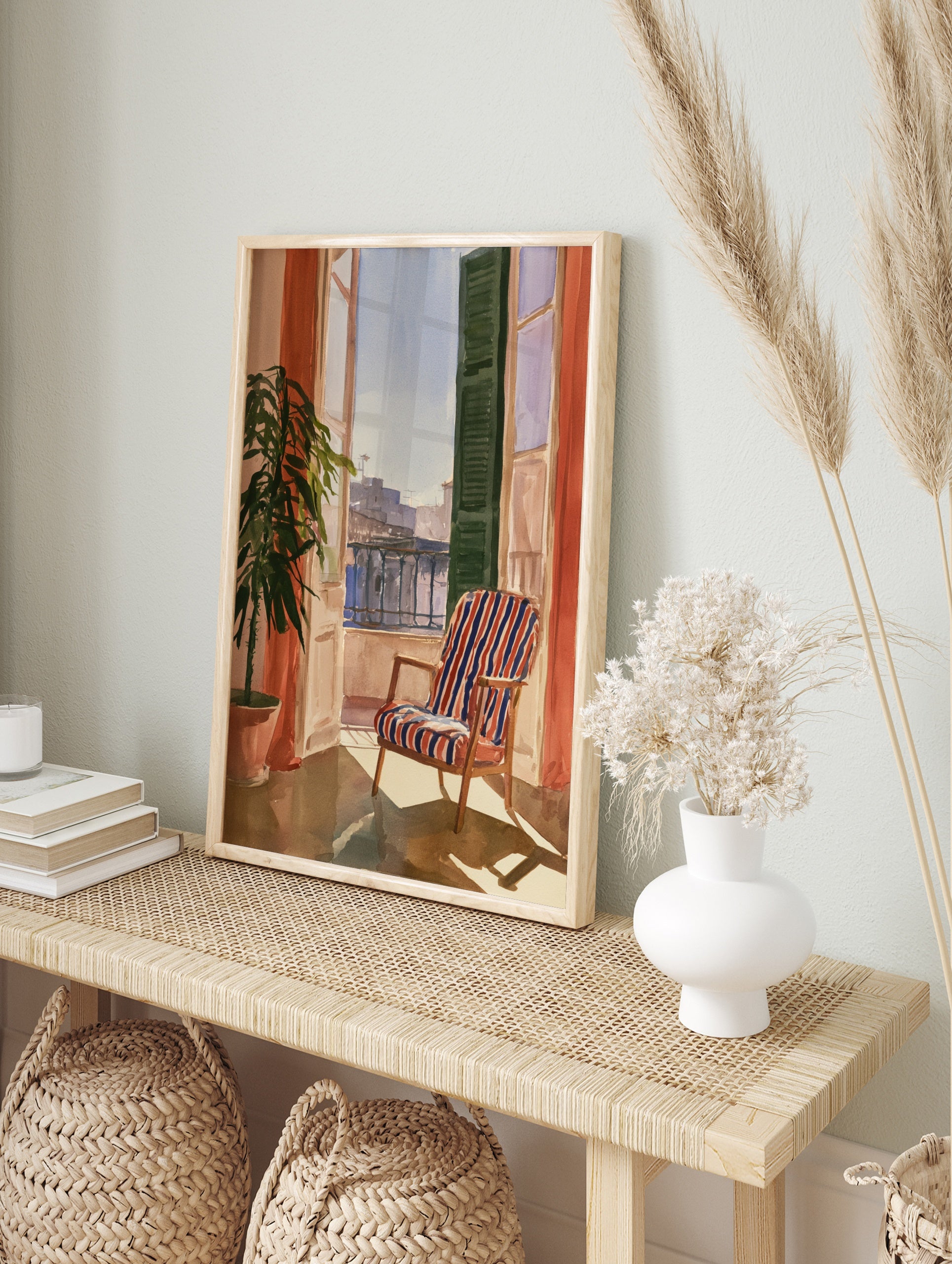 Watercolour painting of a balcony with a striped armchair, open shutter, potted plant, and, in an alternate framed mockup