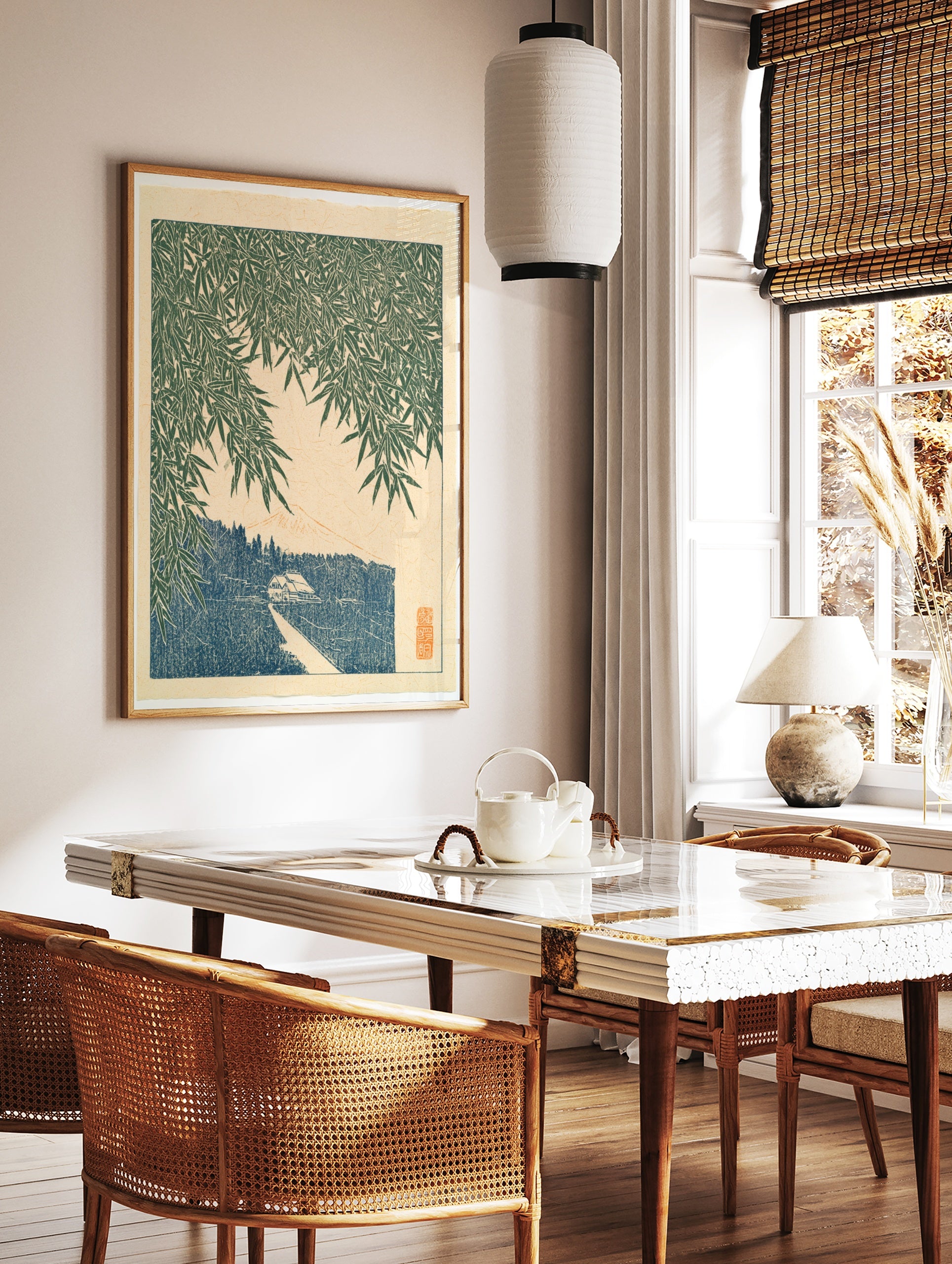Japanese-style art print showing bamboo leaves over a path, a small house, and a mountain peak in, in a styled room mockup