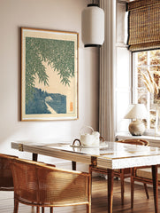 Japanese-style art print showing bamboo leaves over a path, a small house, and a mountain peak in, in a styled room mockup