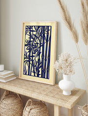 Navy blue stylised bamboo stalks and leaves art print on a light cream background, in a dense, in an alternate framed mockup