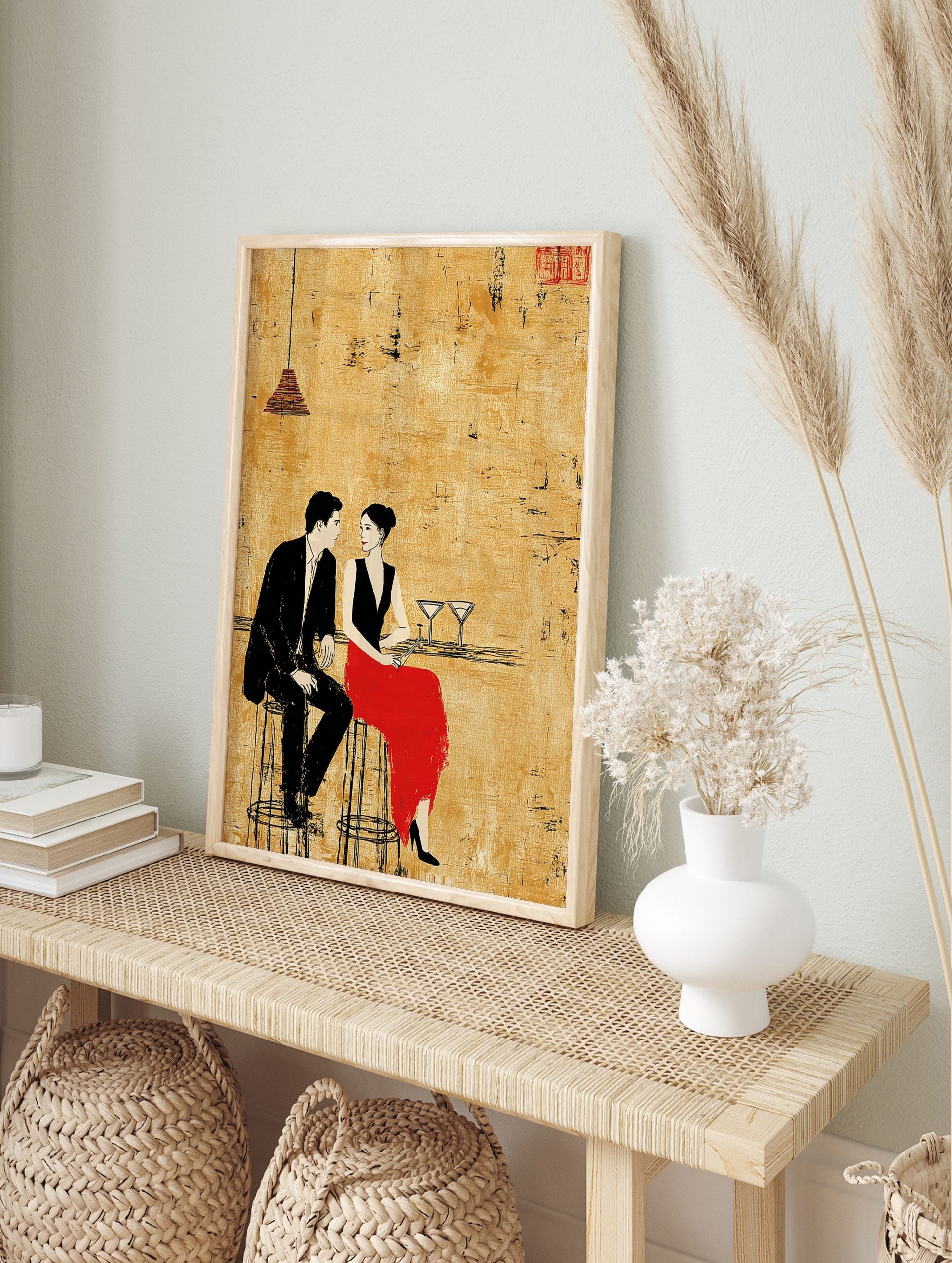 Illustrative print of a man in black suit and woman in red skirt at a bar, textured gold, in an alternate framed mockup