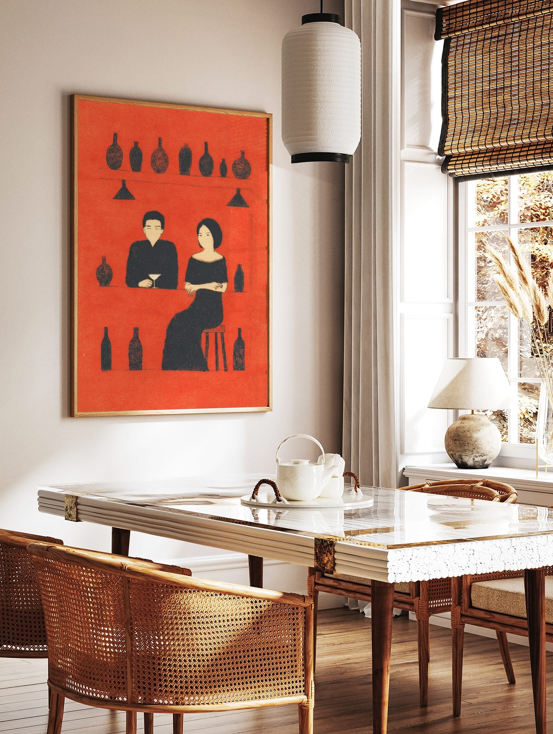 Minimalist bar scene art print with a man and woman in black silhouettes against a red background, in a styled room mockup