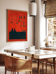 Minimalist bar scene wall art with two figures, bottles, and pendant lights against a vibrant red, in a styled room mockup