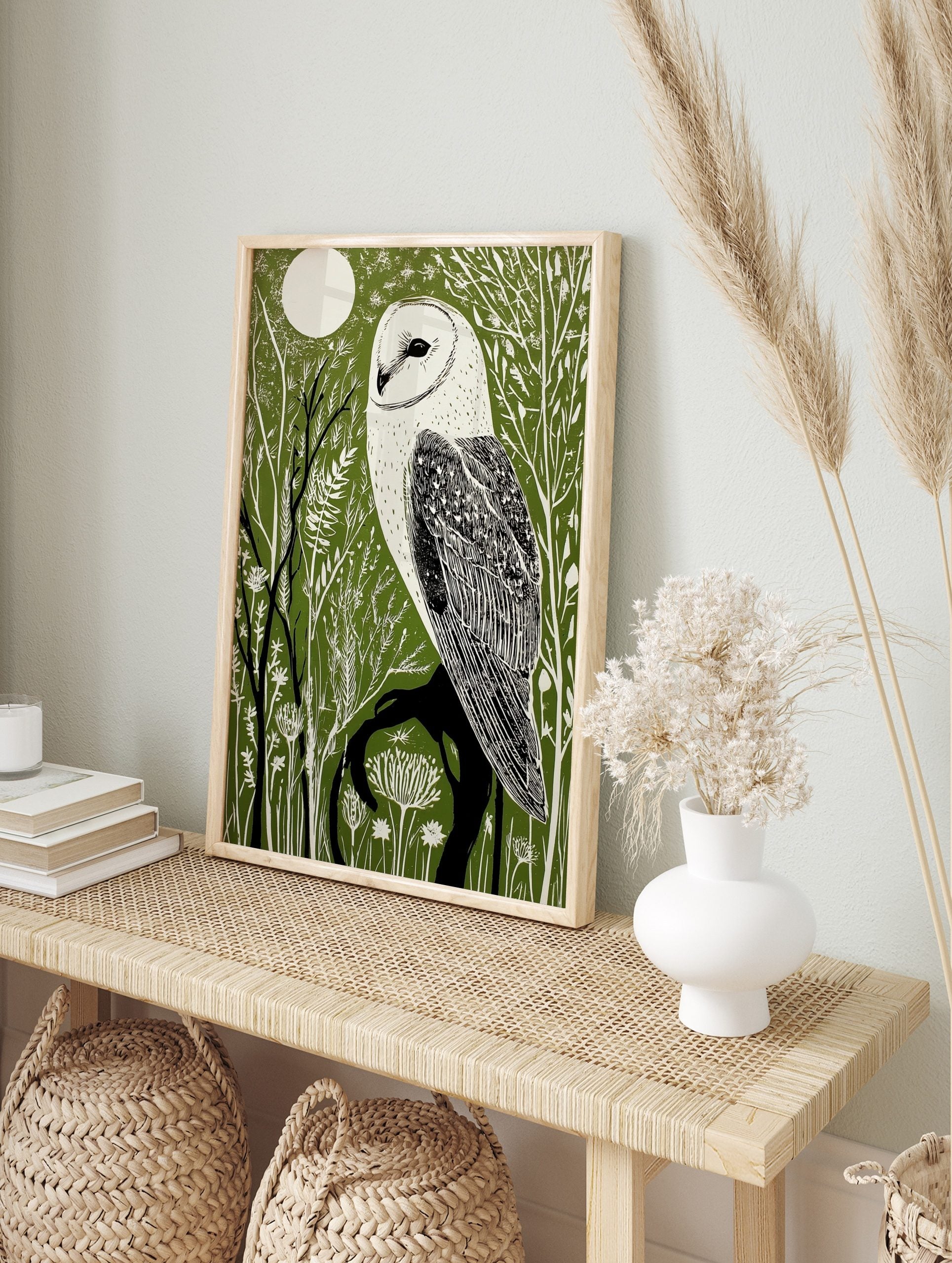 Illustrative barn owl print with white owl on a dark branch against a dark green forest and, in an alternate framed mockup