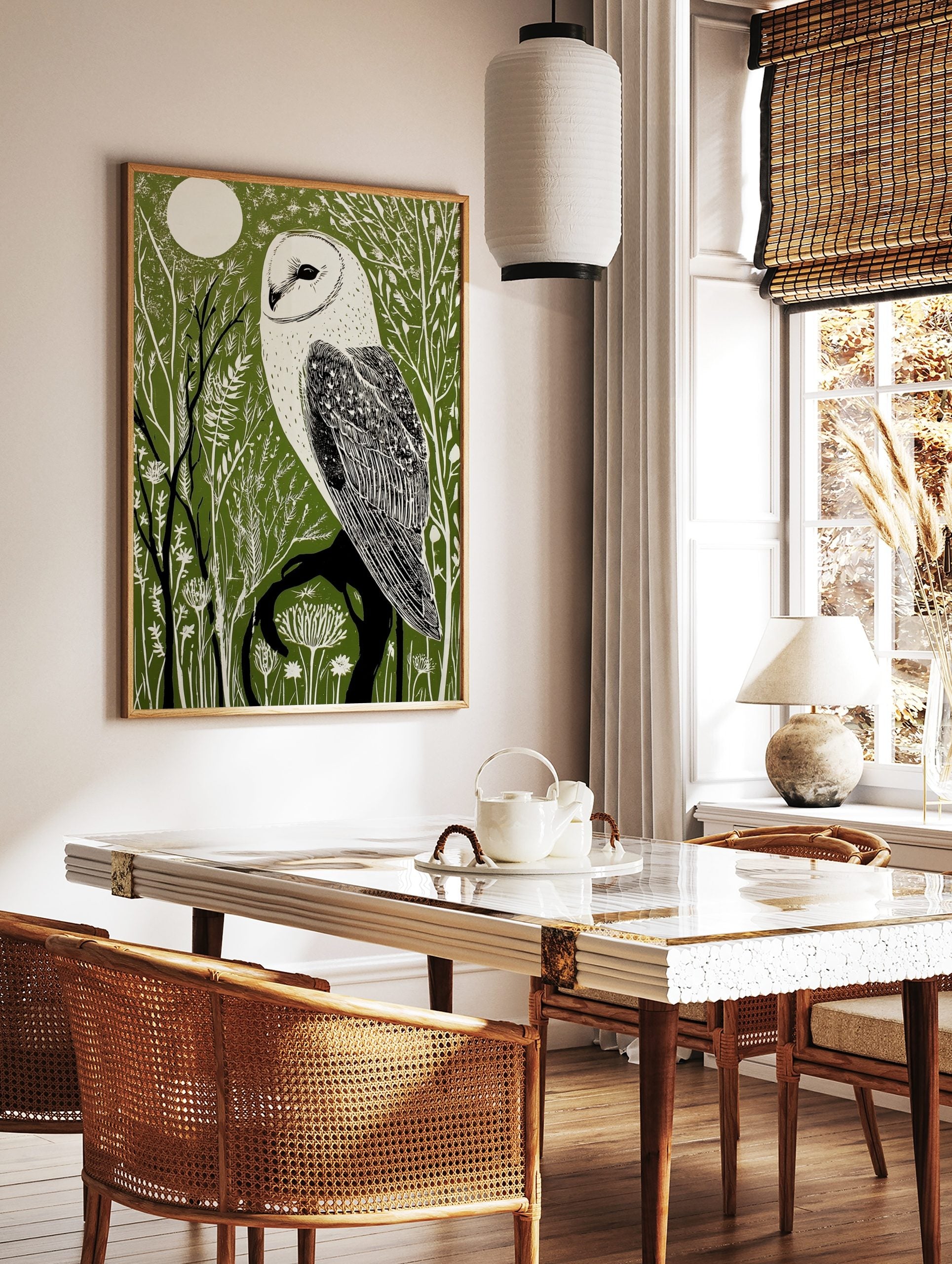 Illustrative barn owl print with white owl on a dark branch against a dark green forest and white, in a styled room mockup