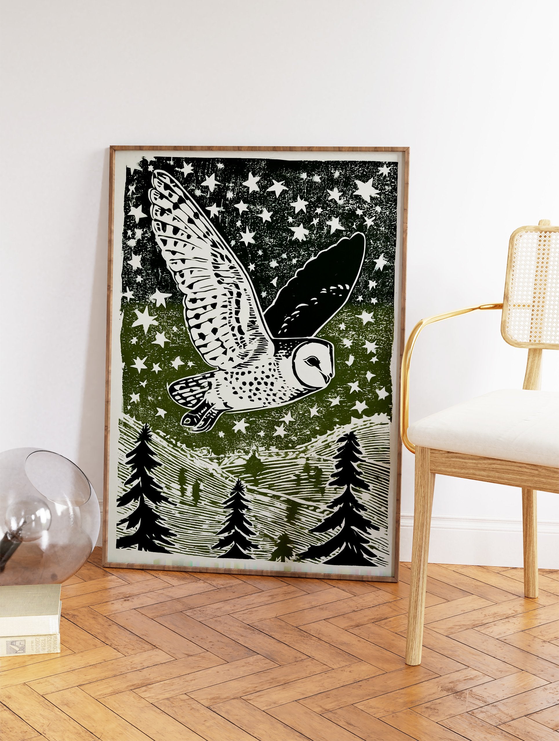 Barn owl flying across a starry night sky above a forest of pine trees, in a green and white linocut style print. - Image 2