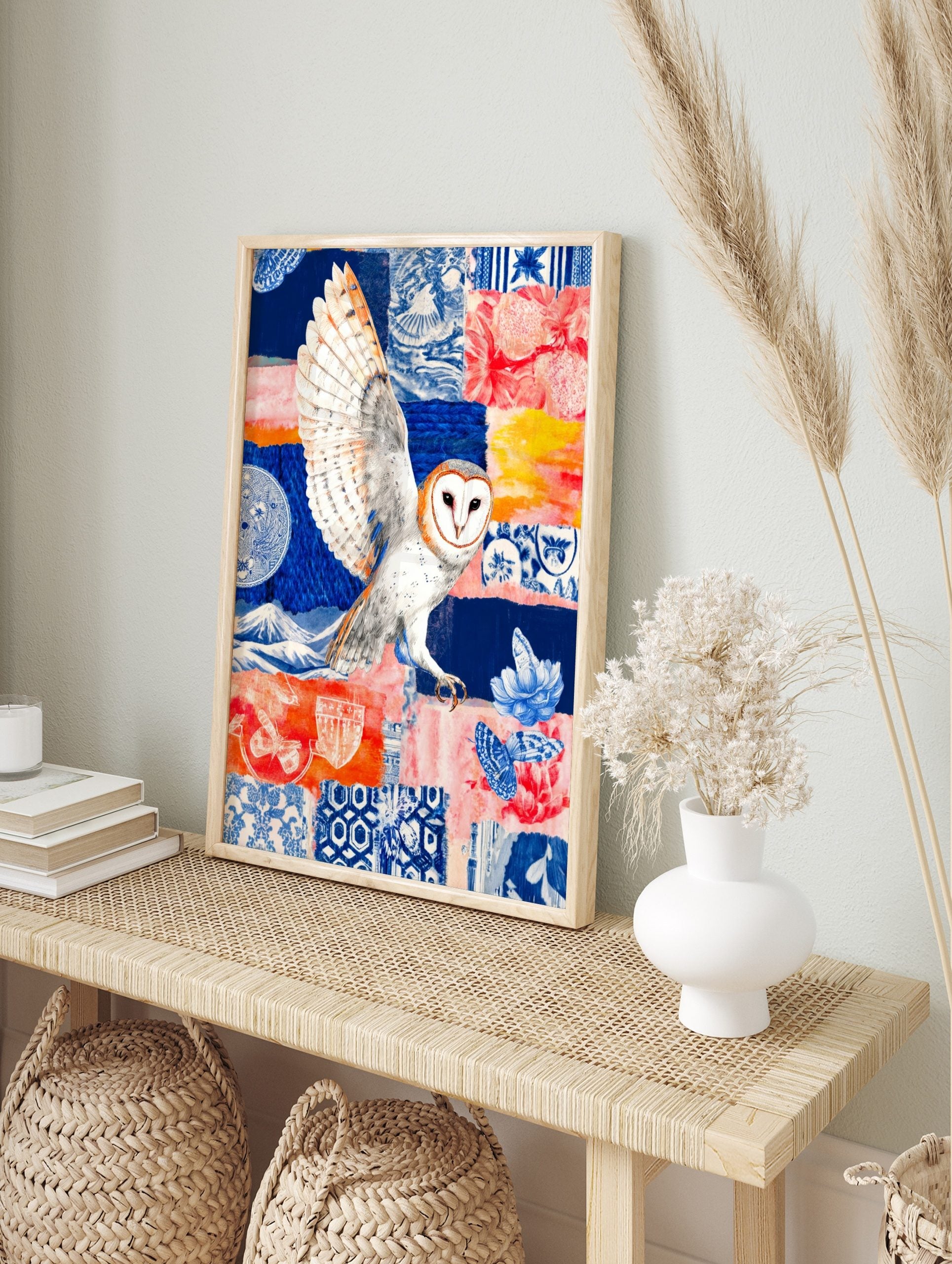 Barn owl in flight over a colourful collage background with blue Japanese patterns, red, in an alternate framed mockup