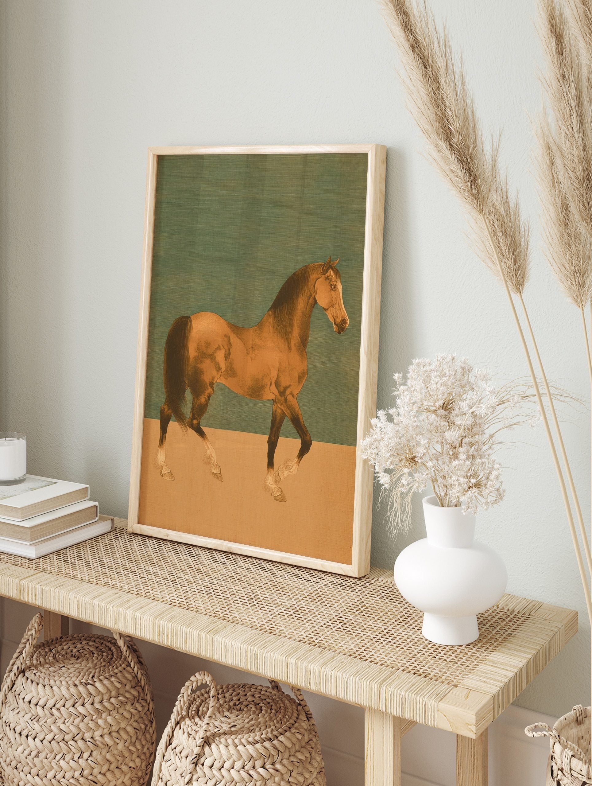 Illustrative bay horse walking in profile against a two-tone teal and beige background art, in an alternate framed mockup