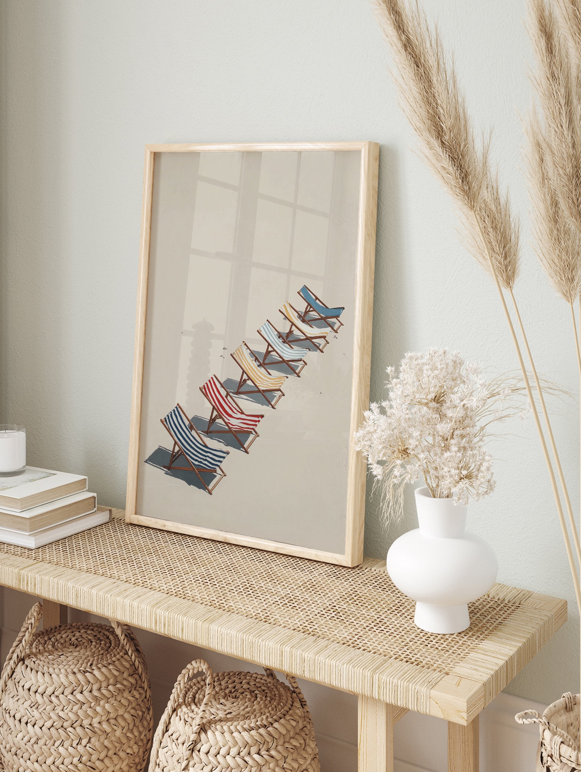 Beach chairs poster with blue, red, and yellow striped chairs lined up on a beige sandy beach under sunlight. - Image 4